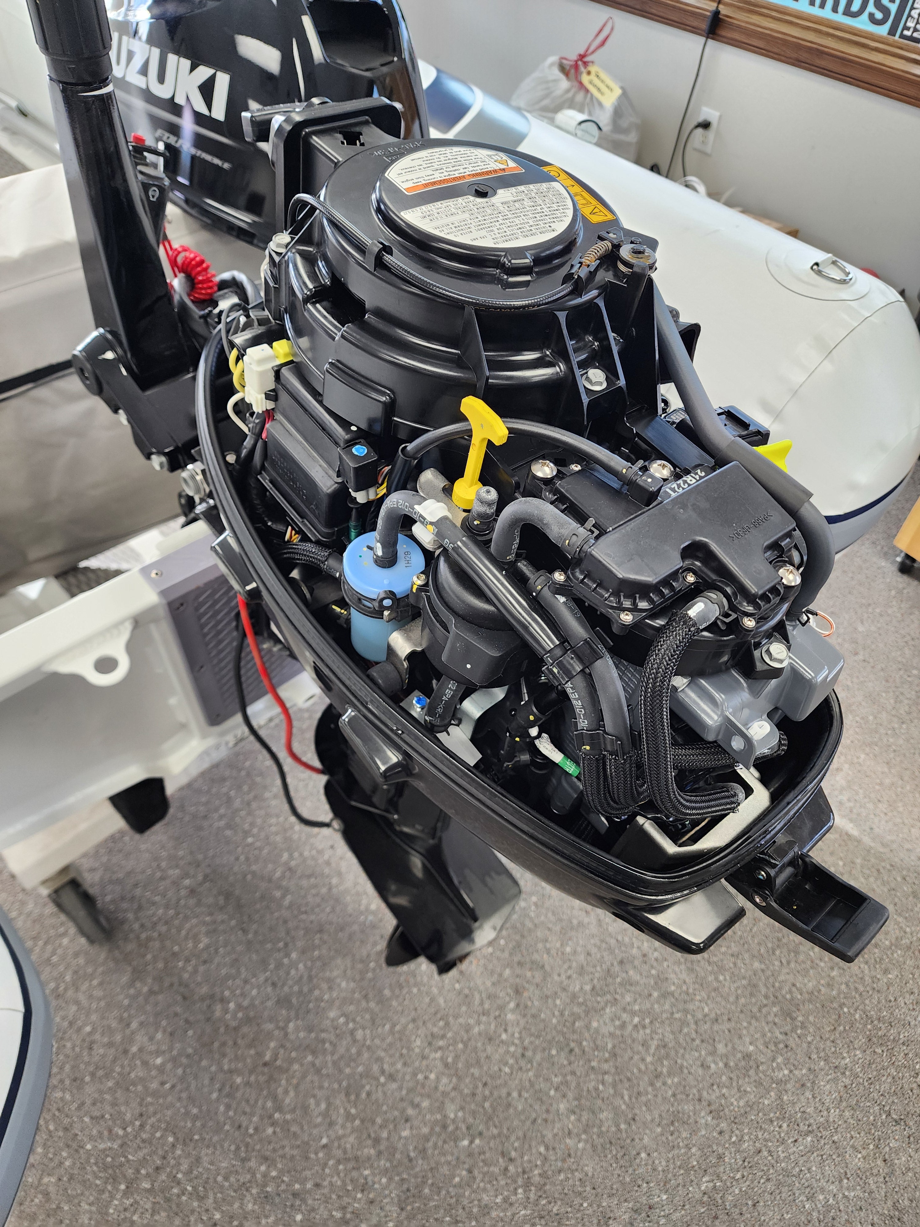 Inflatable boat with Suzuki motor on display in a showroom RIB Highfield Dinghy UL290 2025