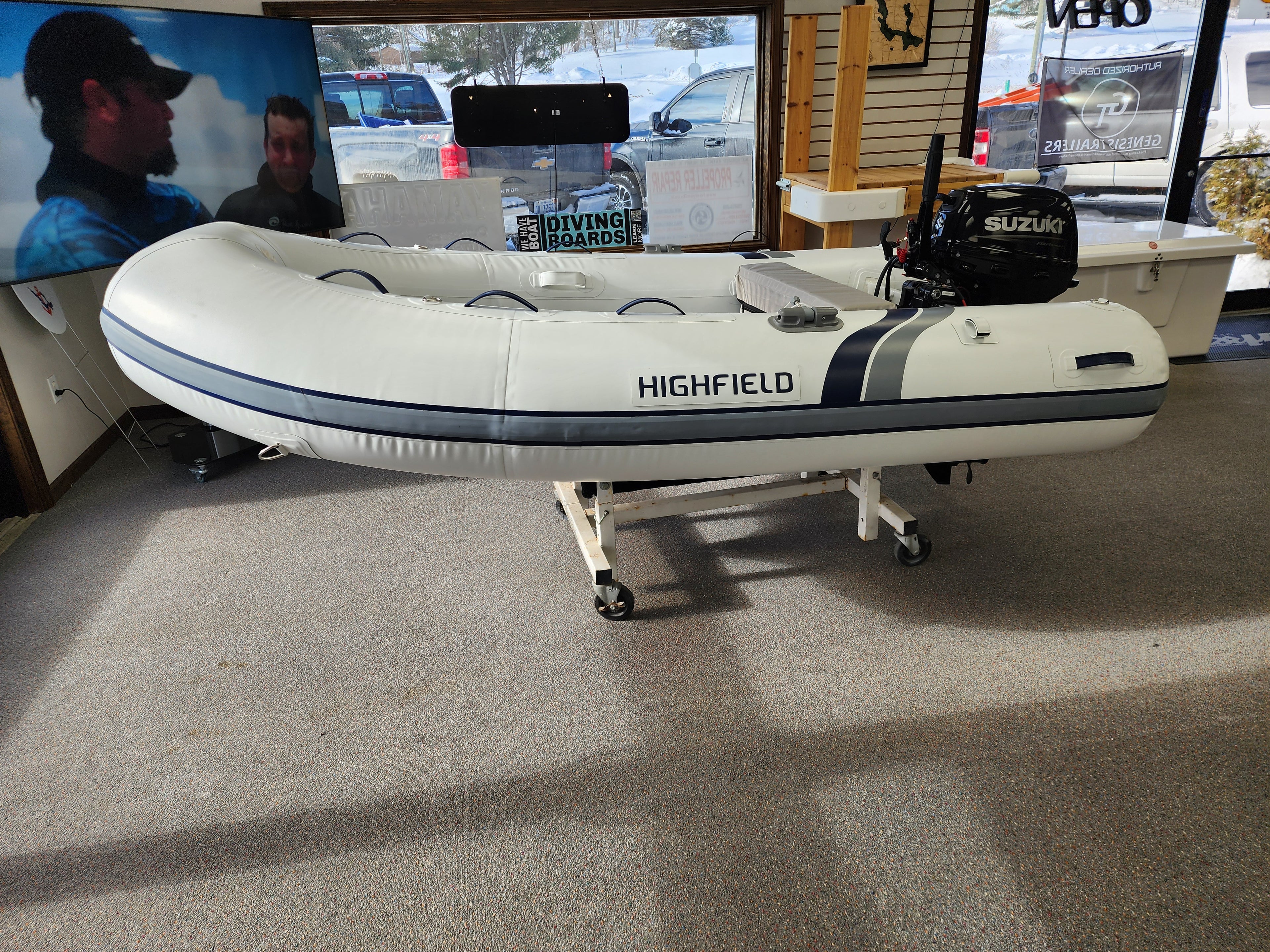 Inflatable boat with Suzuki motor on display in a showroom RIB Highfield Dinghy UL290 2025