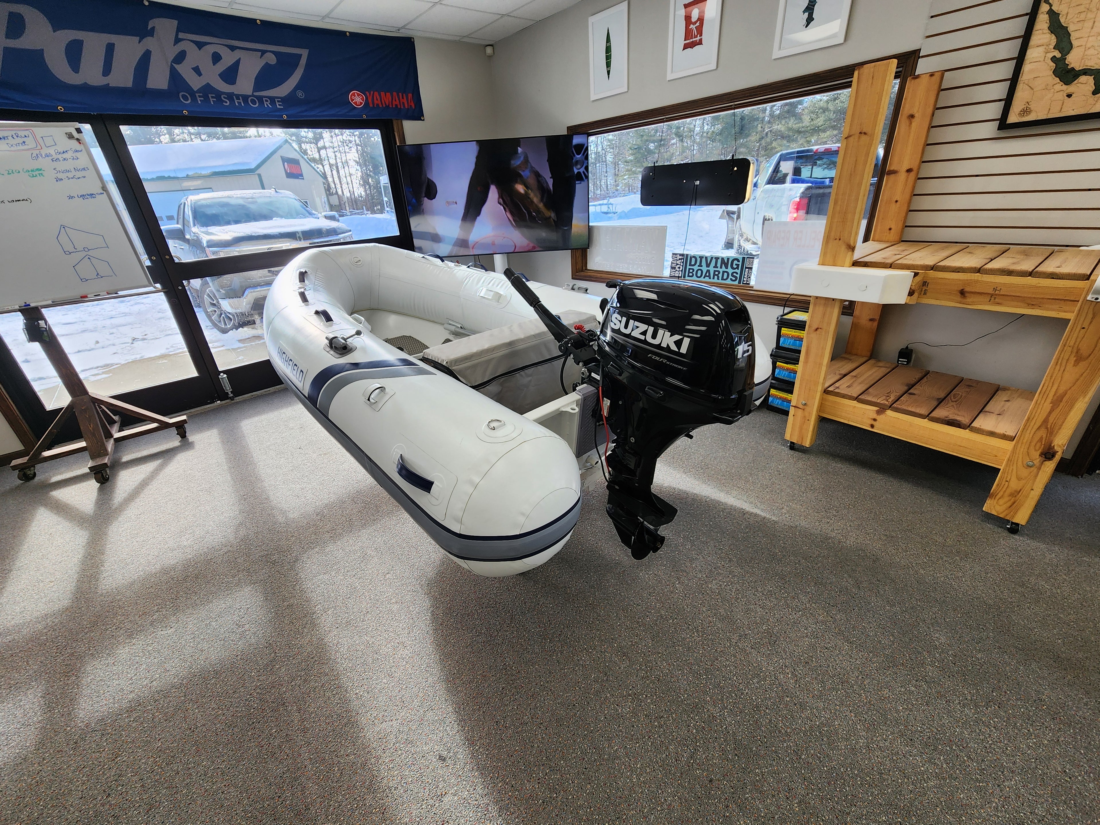 Inflatable boat with Suzuki motor on display in a showroom RIB Highfield Dinghy UL290 2025