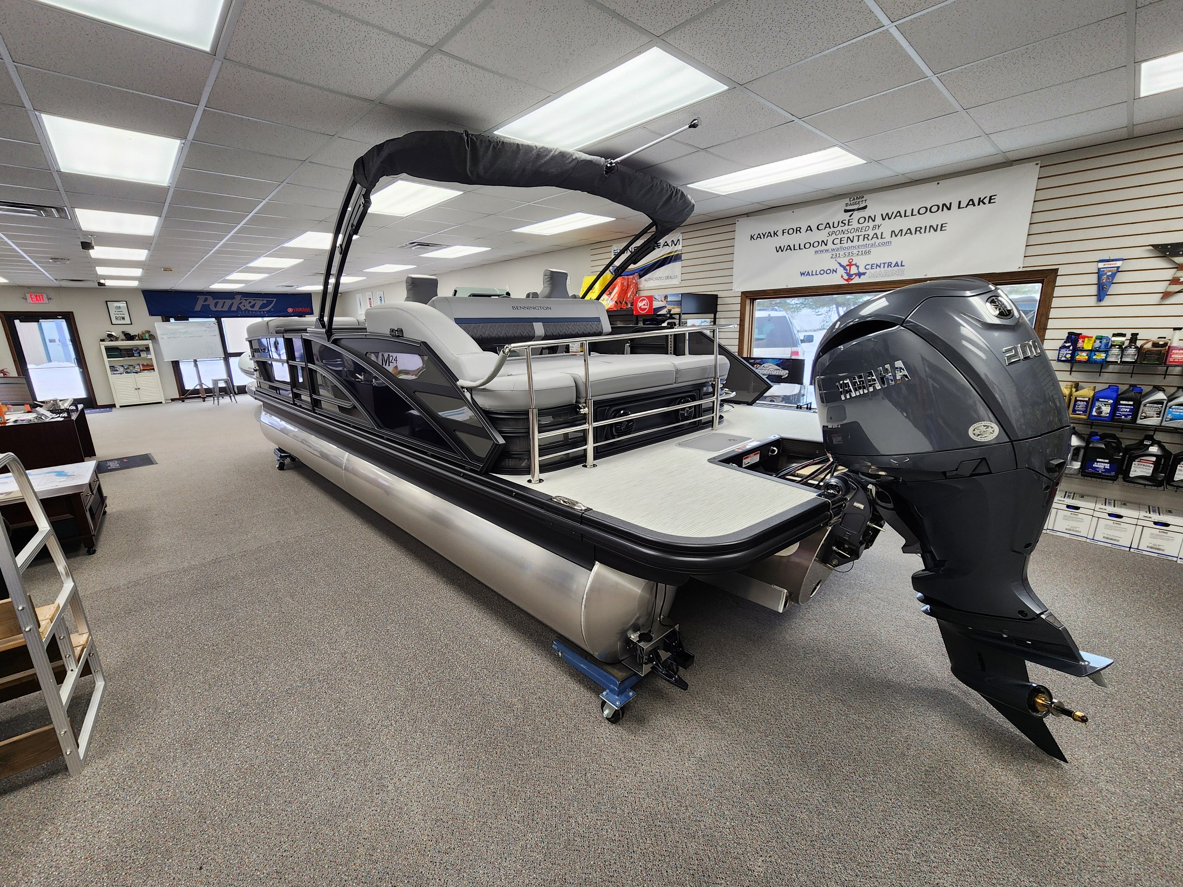 2026 New Bennington 24MSB Pontoon / Tritoon For sale near Charlevoix with 200hp Yamaha Outboard. At a Marina, Blue and Silver