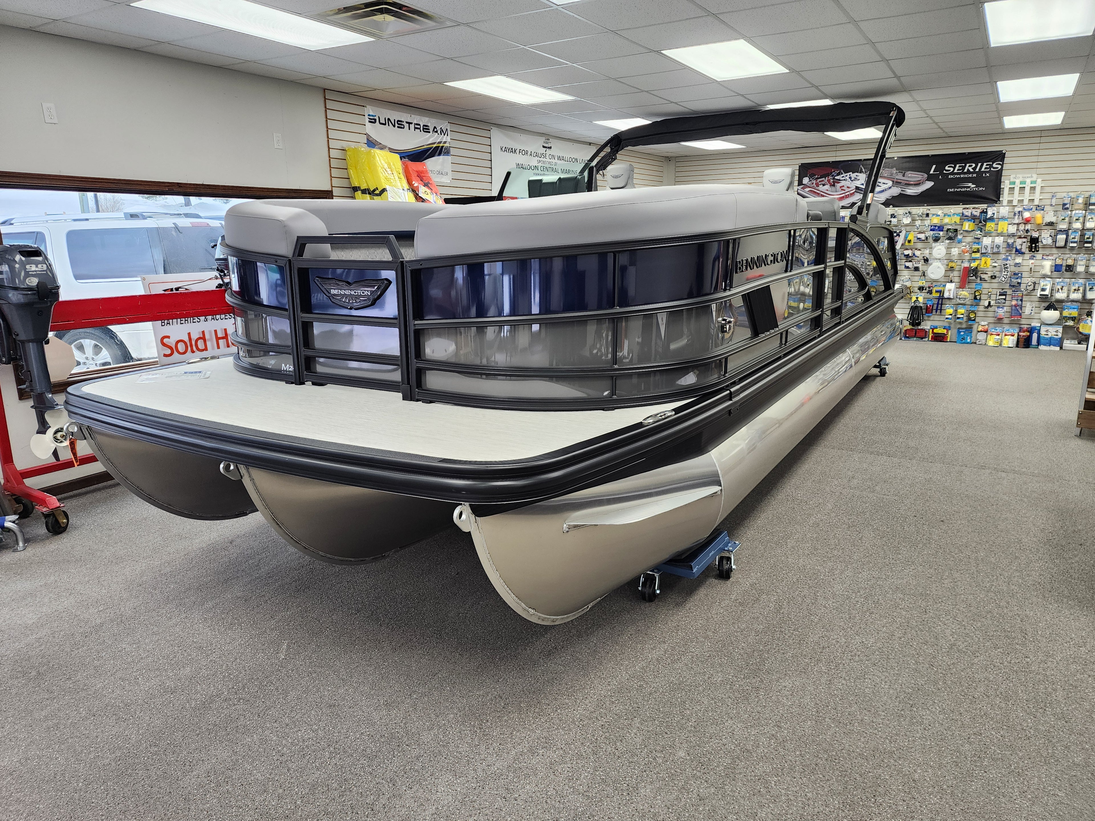 2026 New Bennington 24MSB Pontoon / Tritoon For sale near Charlevoix with 200hp Yamaha Outboard. At a Marina, Blue and Silver